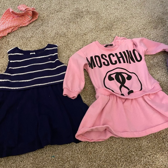 Tommy Hilfiger dress  $40. Moschino dress : $100 both 12months